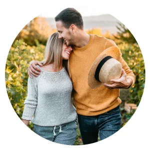 A happy couple embracing outdoors, reconnecting.